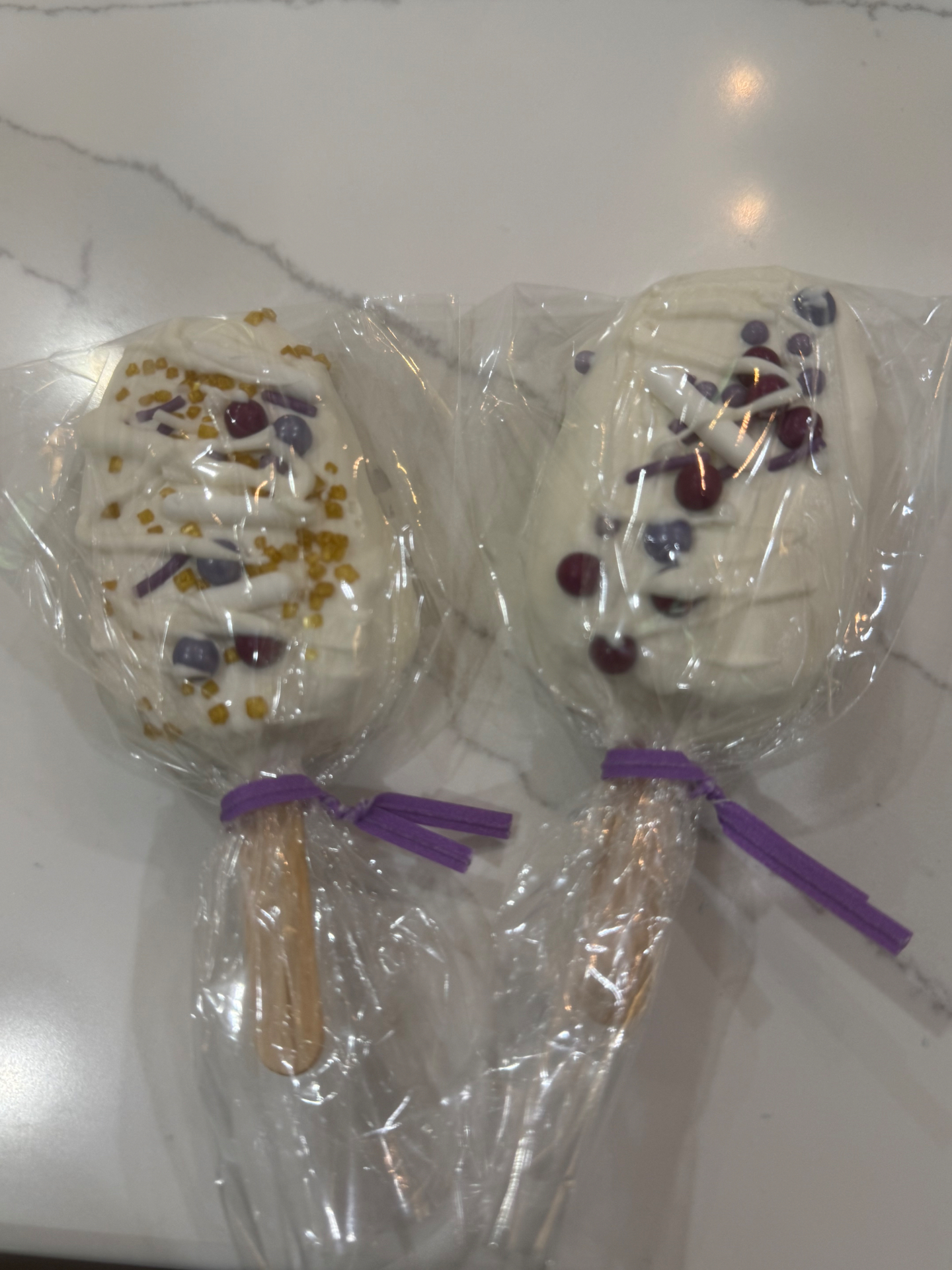 Pair of berry purple cakesicles