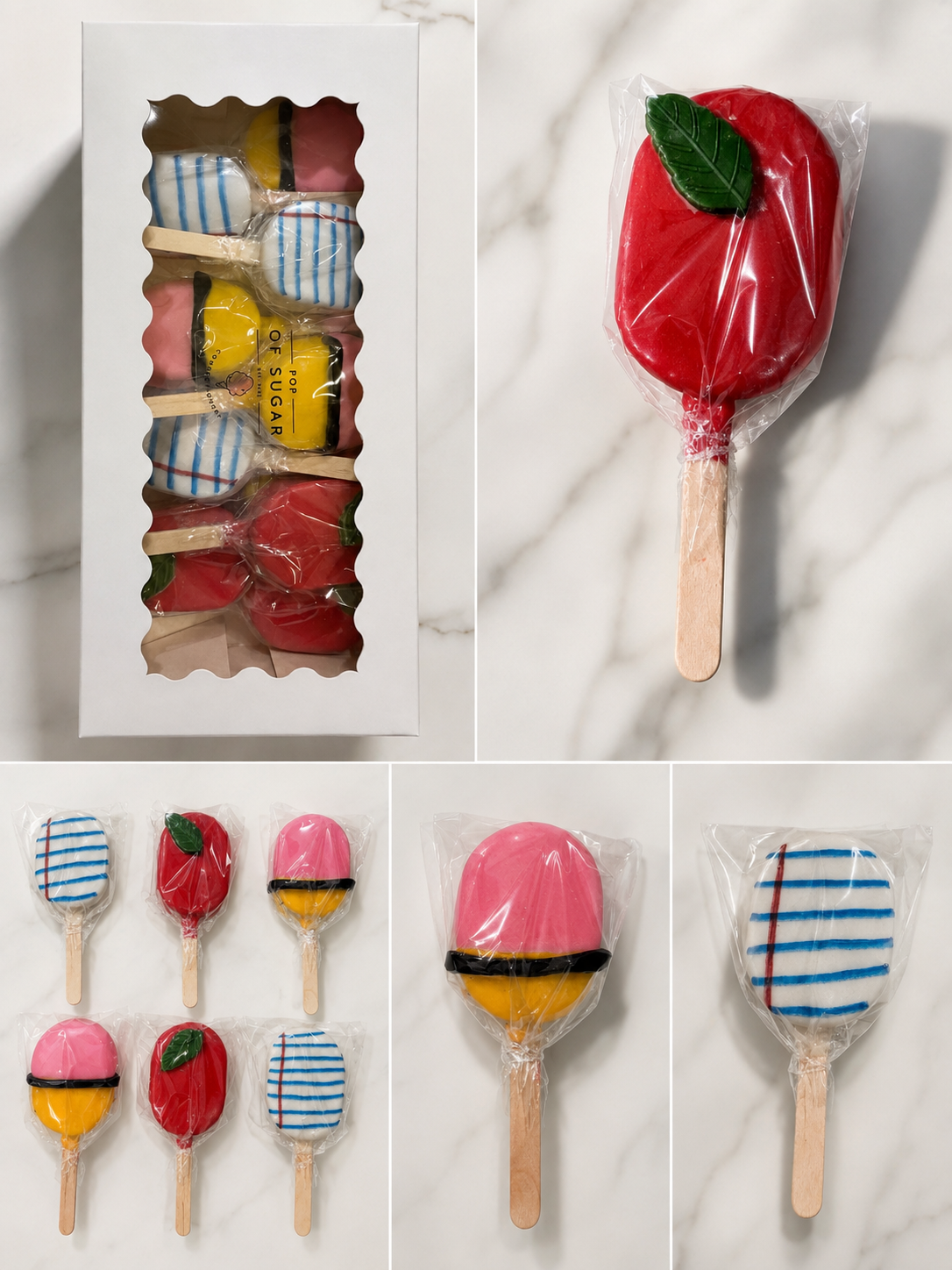 Back to school themed cakesicles shaped like an apple, a pencil, and lined notebook paper in a gift box