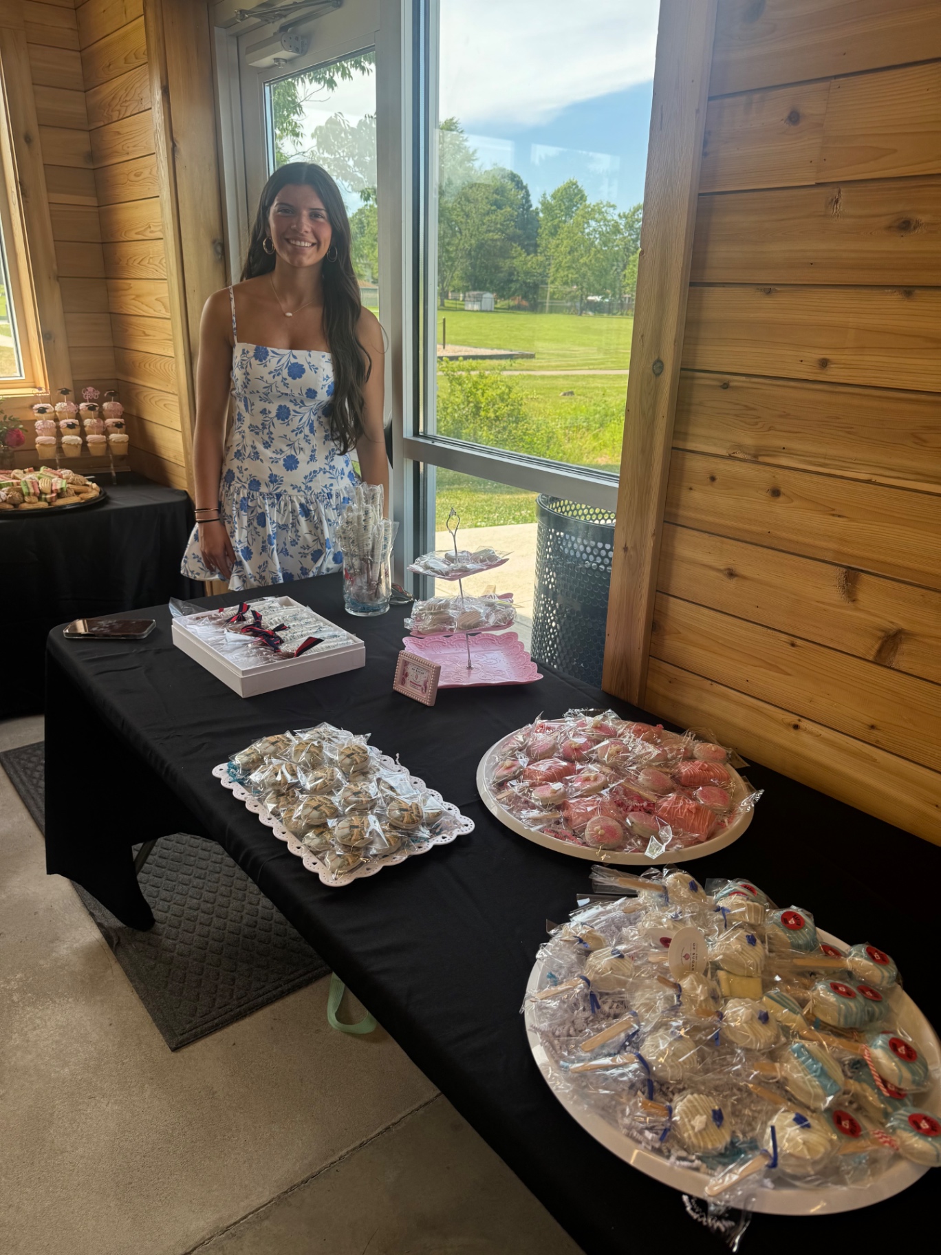 Graduation party dessert table with assorted treats and display styling