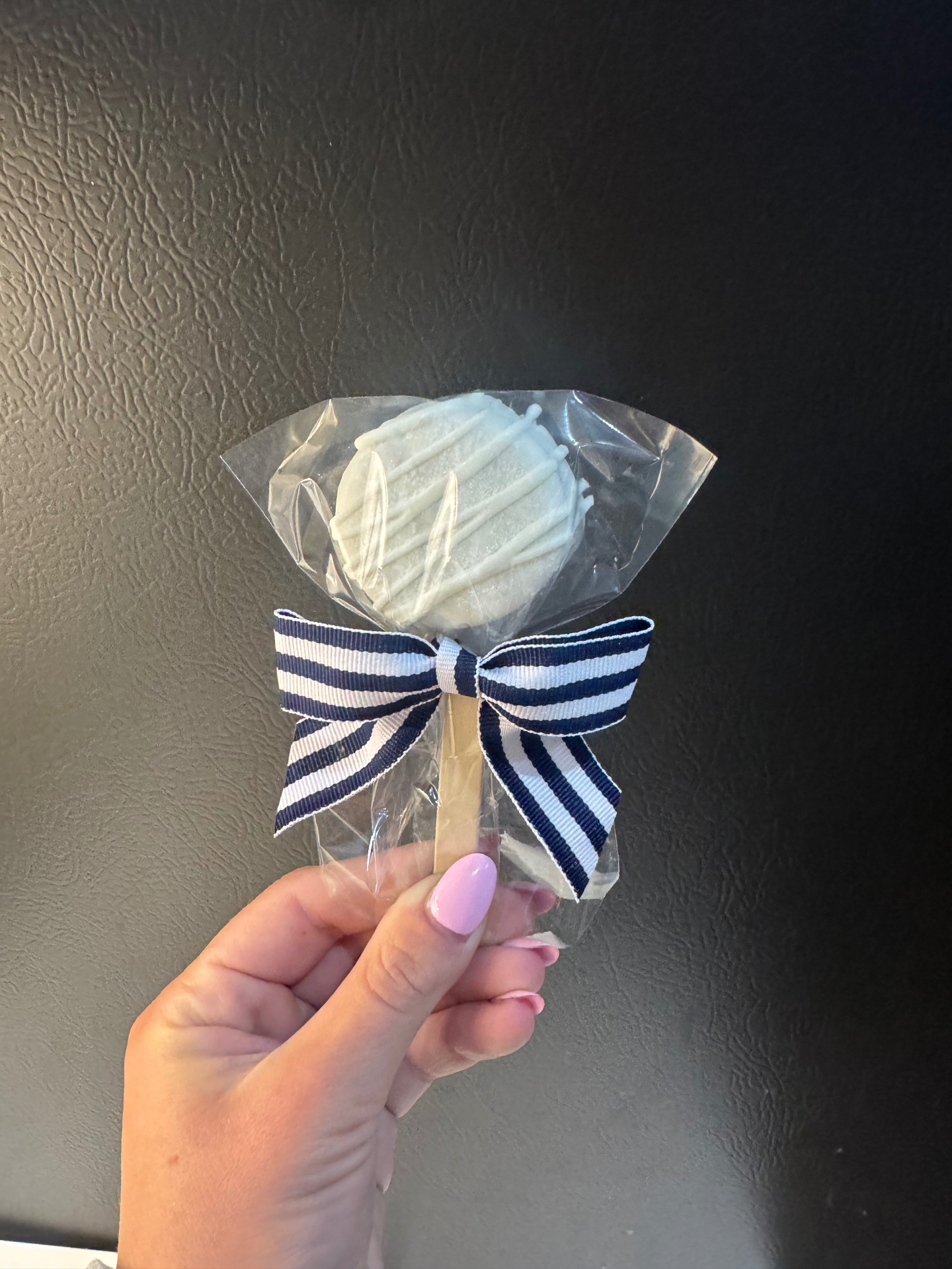 Navy bow dipped Oreo pop