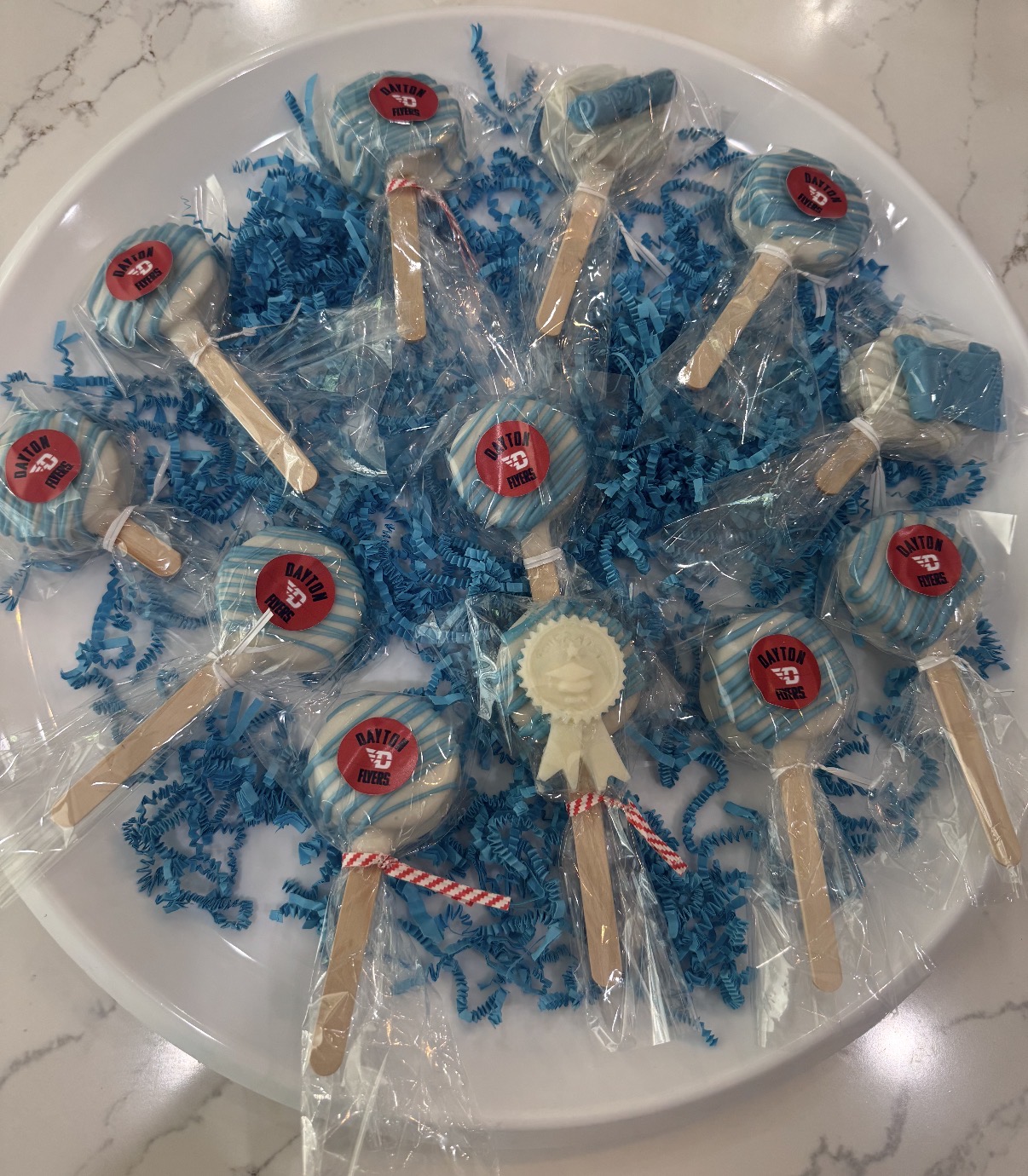 Dayton Flyers themed cake pops on a platter